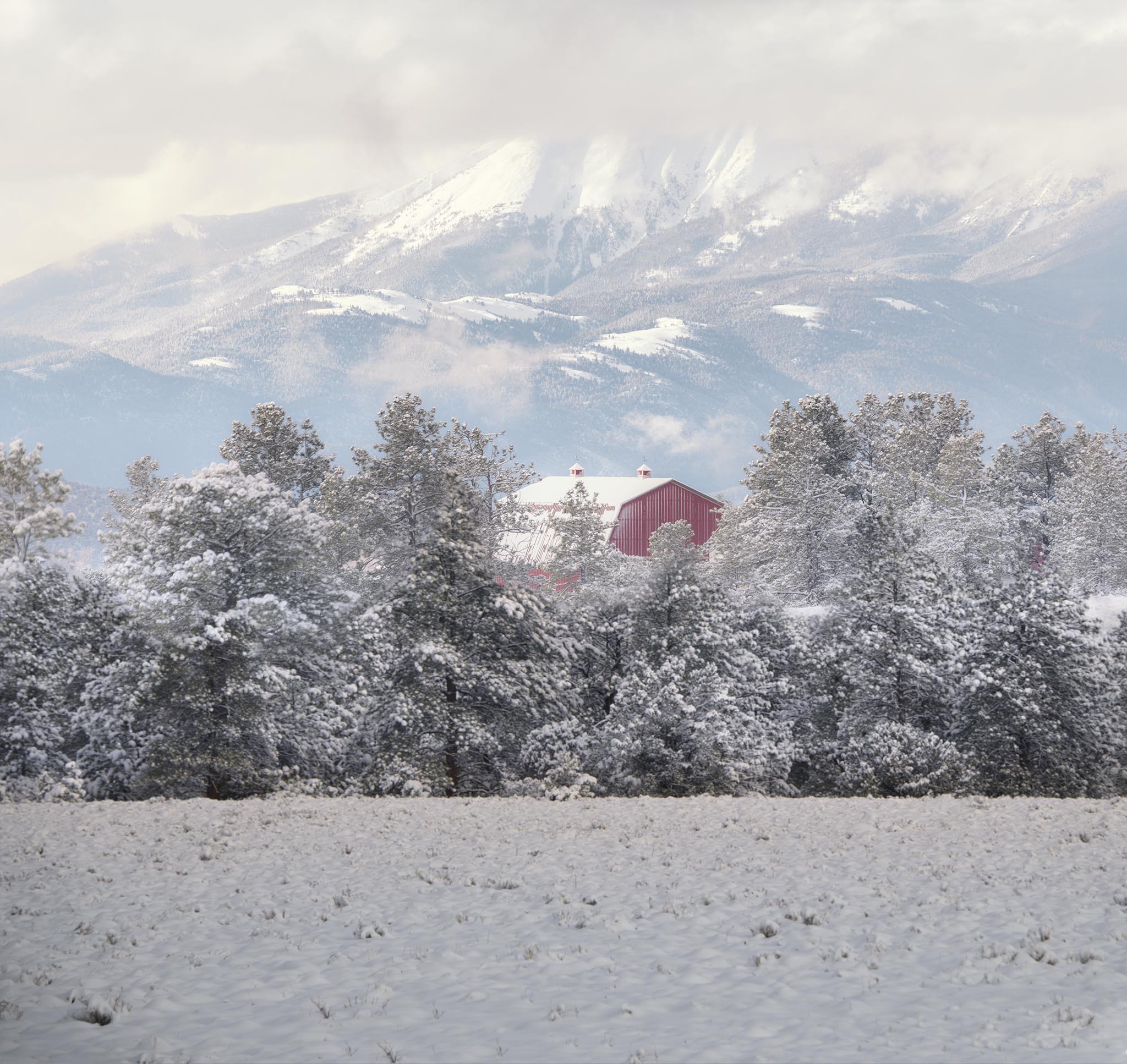 Barn Among Snowy Mountains Picture