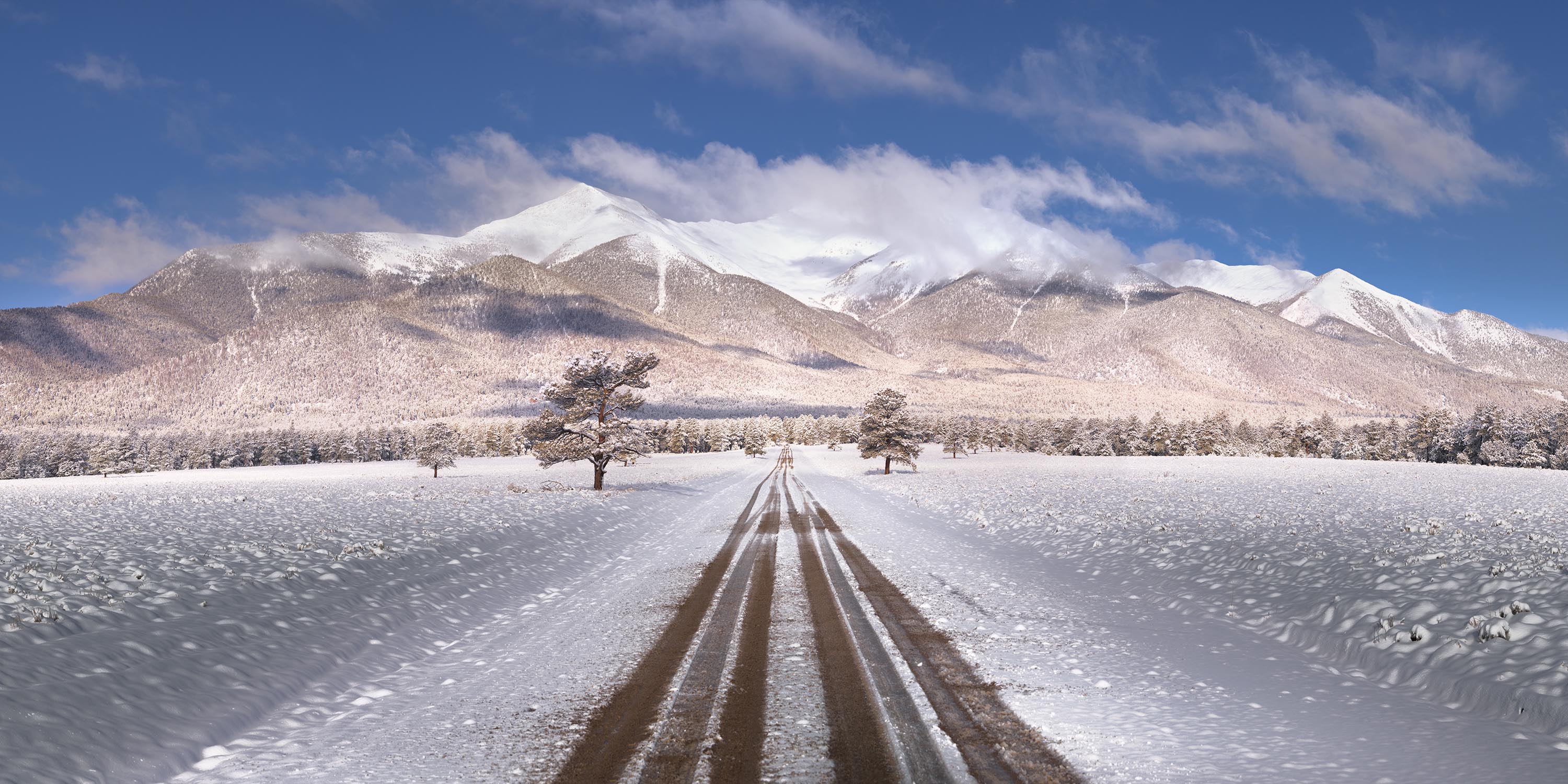 Road Leading to Snowy Mountains