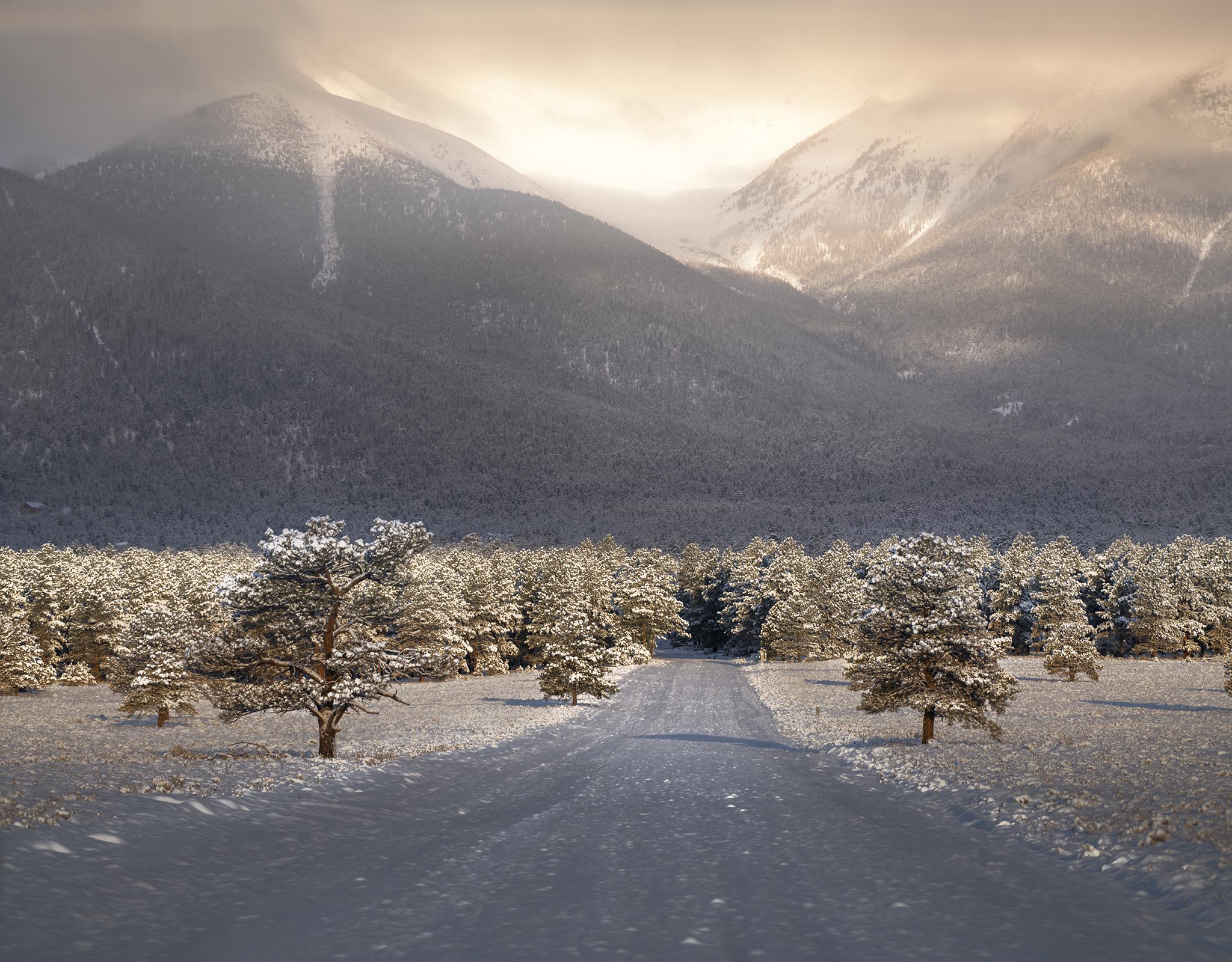 Snowy Road Leading to Dreamy Mountains